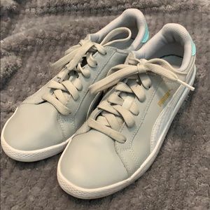 Gray Pumas with mint and gold details